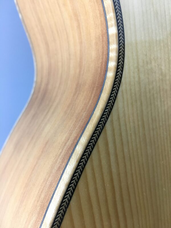 A1MCA Monterrey Cypress sides and Adirondack top with maple binding and herringbone purfling